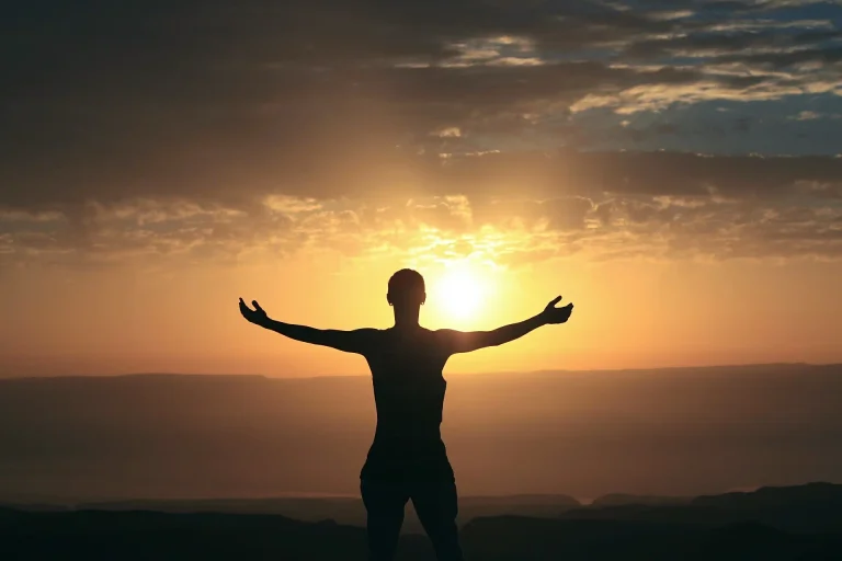Biohacking, woman outside at sunrise
